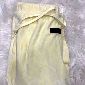 Size small yellow sweat pants. Worn once, in great condition.